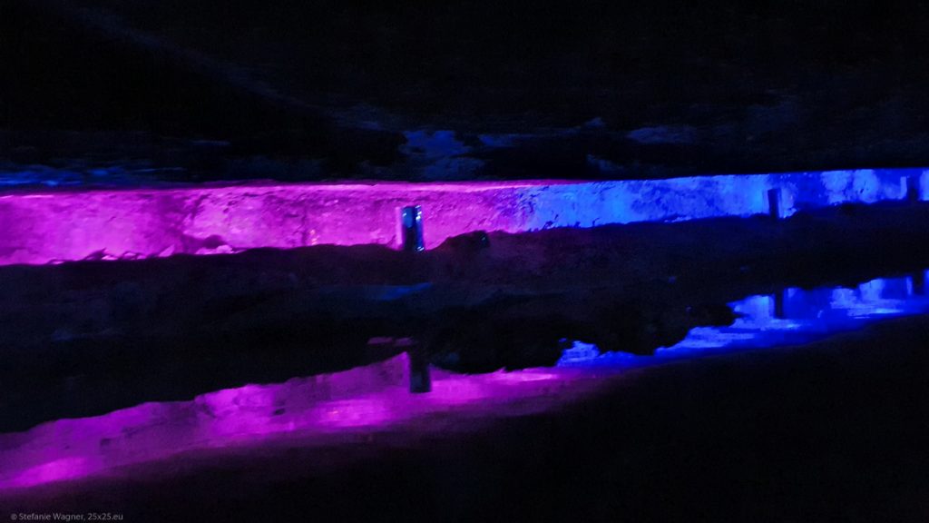 Pink and blue light reflecting in water