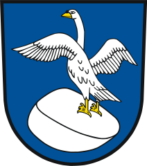 Emblem showing a rock and on top of it a swan