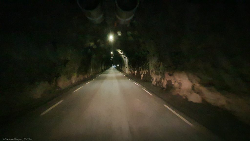 Dark, narrow street tunnel