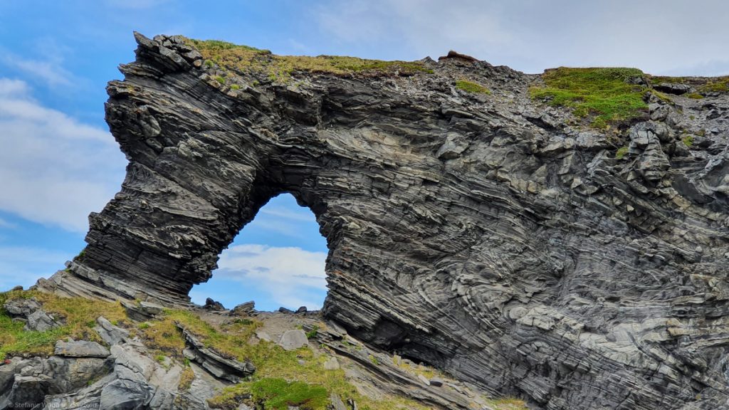 Rock formation where stone is visibly folded and forms an arc