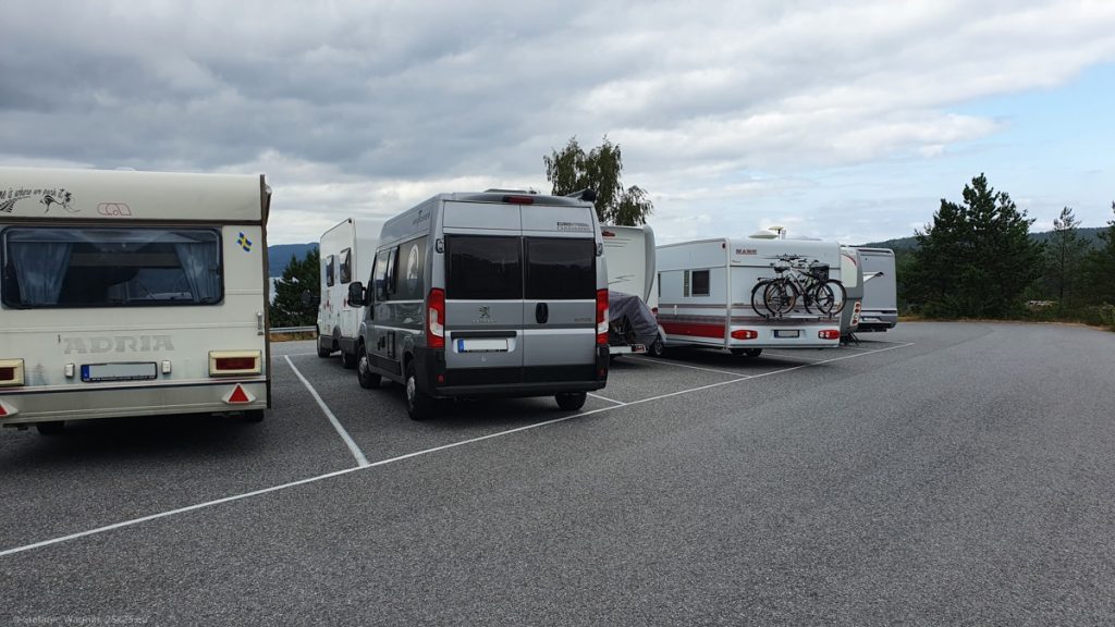 Parking lot for camper vans/trailers, all spots taken, my camper van behind another camper van on one spot