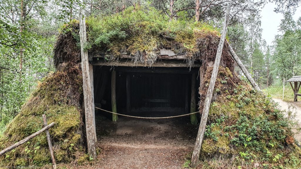 Rectangle construction, covered with moss, big opening