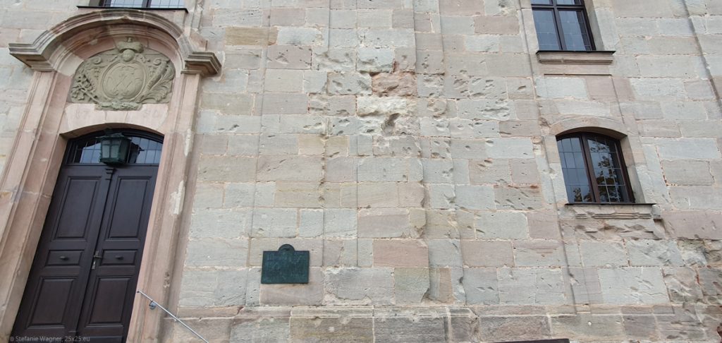 Stone wall of a churche with explosion holes